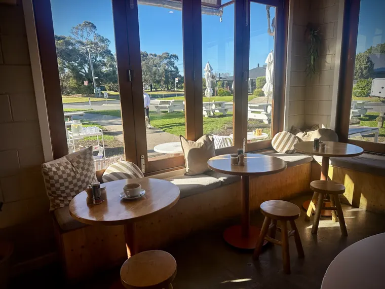Sunlit window bench seating with cushions looking out over the reserve